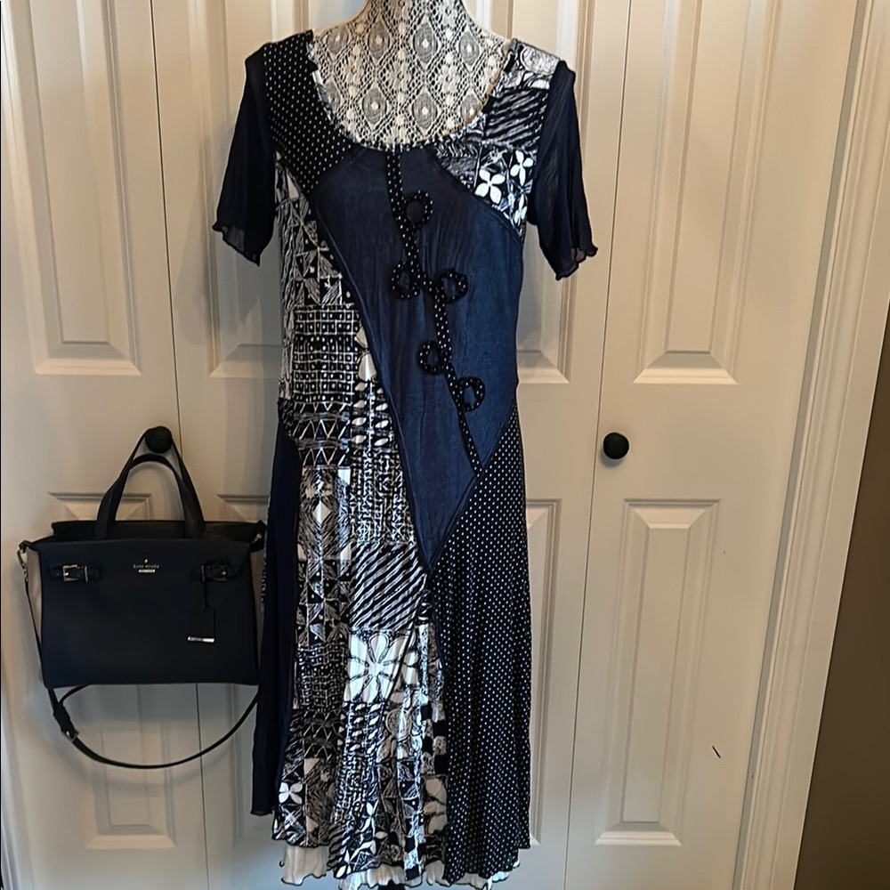 Black white and navy patchwork short sleeved fit and flare dress.